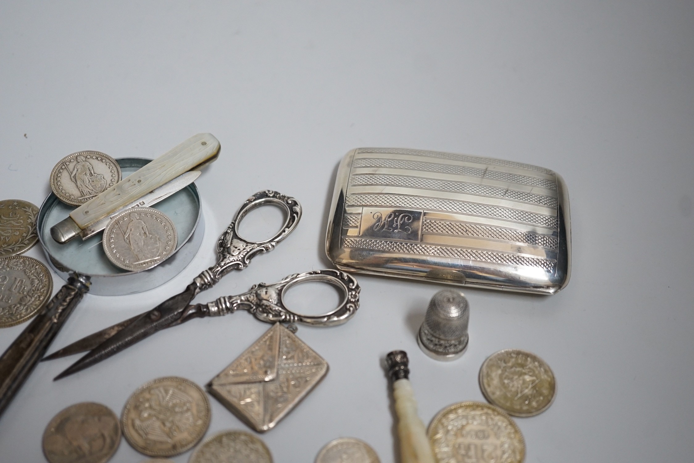 Miscellaneous small silver and white metal items including thimbles, a cigarette case, envelope stamp case, fruit knife, seal, etc and a group of assorted coinage including a silver crown in pendant mount.